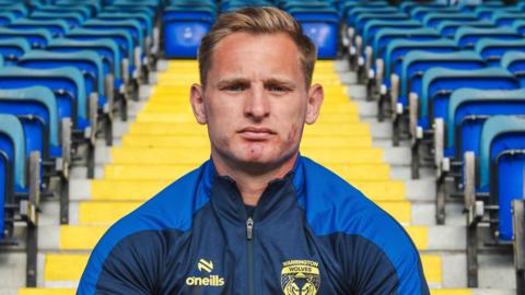 Brad Dwyer at the Halliwell Jones Stadium after re-signing for Warrington