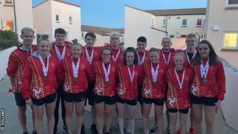 The Isle of Man swimming team show off their medals from the Island Games
