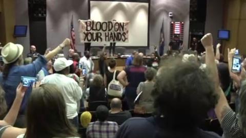 Protesters at a city council meeting in Charlottesville, Virginia.