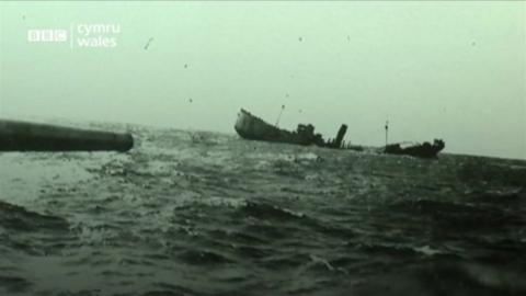 A still image of a ship sinking
