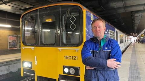 Ian Birch in front of train