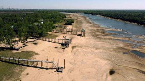 Aerial view of piers on an almost dry arm of the Parana river, during a historic drought, near Rosario, Santa Fe, Argentina, on August 22, 2021.