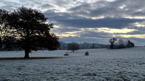 Picture taken at dawn at Hadleigh in Suffolk showing countryside, frost and broken cloud