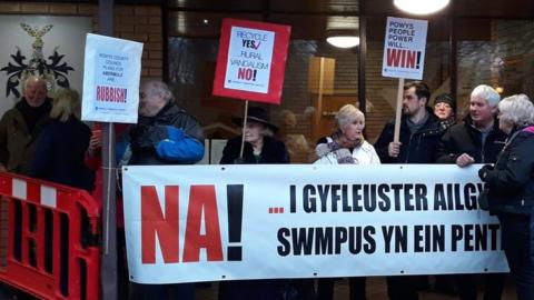 Abermule villagers protest outside Powys County Hall in Llandrindod Wells in January 2019
