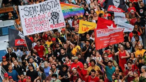 Pro-democracy demonstrators march in Porto Alegre, Brazil