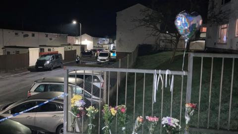 Tributes at a Wildmill, Bridgend, property