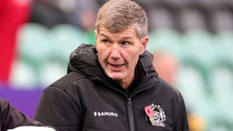 Exeter director of rugby looks on as his team warms up