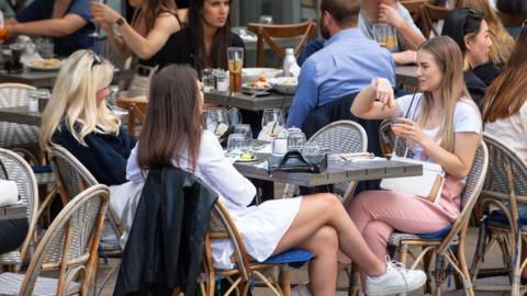 People drinking outside in London