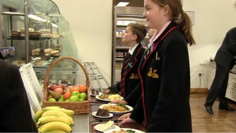 pupils line up for food