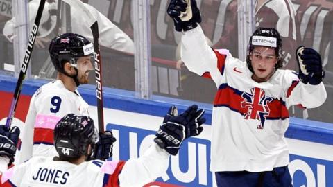 GB celebrate scoring against Latvia.