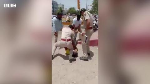 Police restraining a man