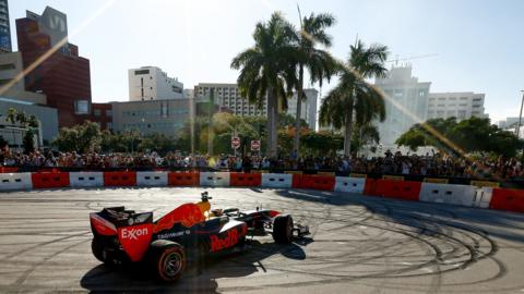 A Red Bull F1 car does donuts at an exhibition in Miami