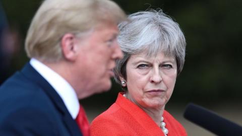 May looks at Trump