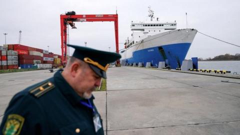 A Russian customs officer works at a commercial port in the Baltic Sea town of Baltiysk in the Kaliningrad region, Russia, in October 2021