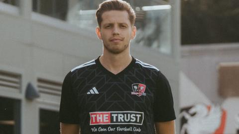 Jack Fitzwater poses outside Exeter's training ground