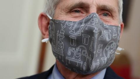 NIH National Institute of Allergy and Infectious Diseases Director Anthony Fauci wears a lab equipment-themed mask