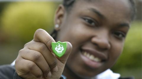 A boy with a Blue Peter badge