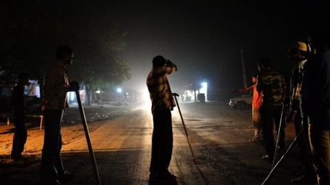 Volunteers of the vigilante group of Gau Raksha Dal (Cow Protection Squad) gather to inspect a truck on a highway in Taranagar in the desert state of Rajasthan.