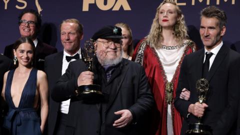 Game of Thrones creator George RR Martin with cast members at the Emmys