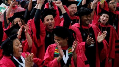 Graduating students from the School of Education cheer as they receive their degrees during the 366th Commencement Exercises at Harvard University on 25 May, 2017.