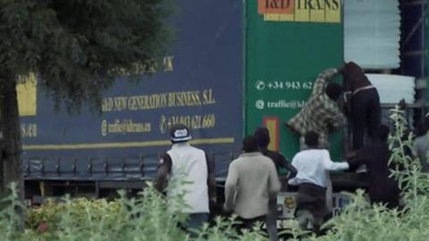 Migrants climbing into lorry
