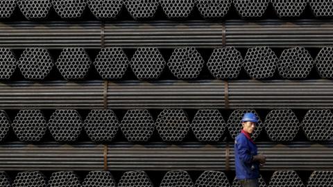 A worker at a steel pipe plant in Tangshan, China