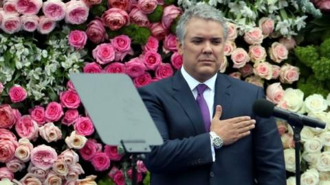 President Duque has hand on chest during swearing in ceremony