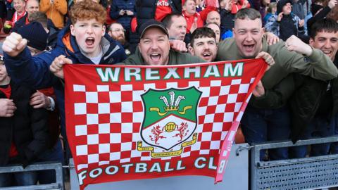 Wrexham fans celebrate as they are promoted