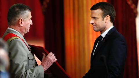 Emmanuel Macron (R) is presented the great necklace of France's National Order of the Legion of Honour at the Elysee presidential Palace on 14 May 2017 in Paris.