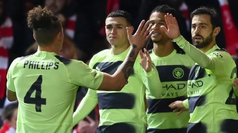 Manchester City players celebrate Phil Foden's goal against Bristol City