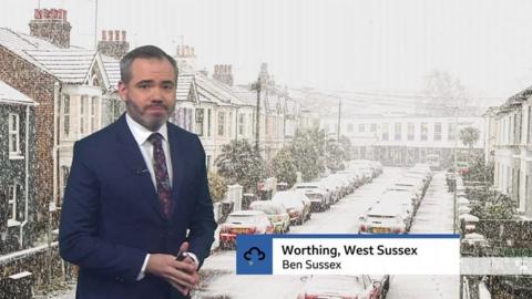 Ben Rich standing in front of a snowy street photo in Worthing