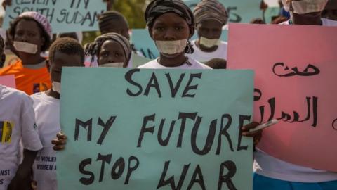 Women from more than forty South Sudanese womens organizations carry placards as march through the city to express the frustration and suffering that women and children face in Juba, South Sudan on December 9, 2017.