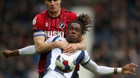 Jake Cooper battles Brandon Thomas-Asante for the ball