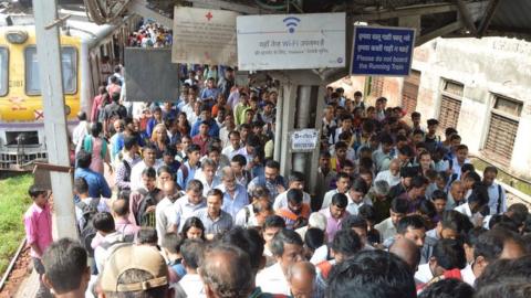 A crowd at a local Mumbai train station