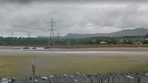 Pylon on the Dwyryd estuary on a low tide exposing sandbanks