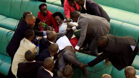 Fighting on the benches in Uganda parliament