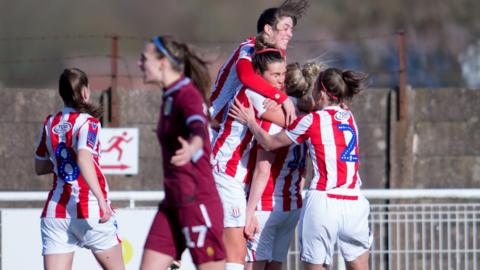 Stoke City women celebrate a goal against Aston Villa