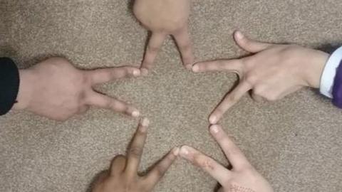 Different fingers joined together to show a star shape