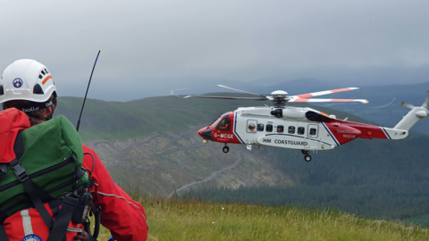 Rescue helicopter and mountain rescue team member