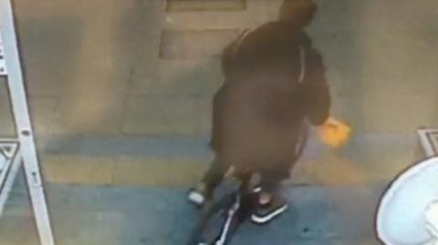 A man is seen riding off from the ReUse Centre in Bedford, in an incident described as "pretty low".
