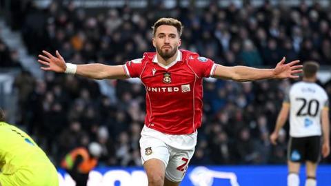 Wrexham striker Sam Smith celebrates