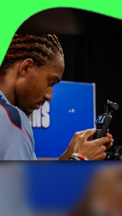 Djed Spence with a video camera
