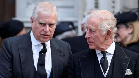 Britain's Prince Andrew speaks with King Charles as they leave Westminster Cathedral at the end of the Requiem Mass, on the day of the funeral of Britain's Katharine, Duchess of KeNt