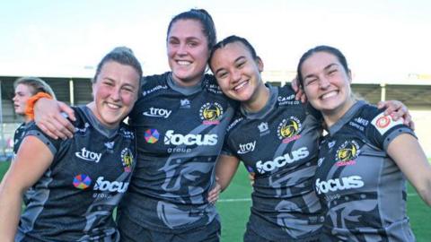 Exeter Chiefs players celebrate a Premiership Women's Rugby victory over Trailfinders Women on 26 October, 2024