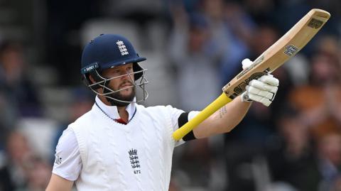 England opener Ben Duckett raises his bat after hitting fifty