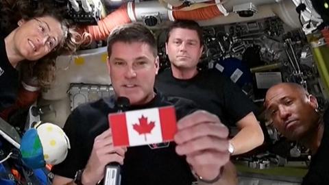 The Artemis astronauts show off the Canadian flag patch.