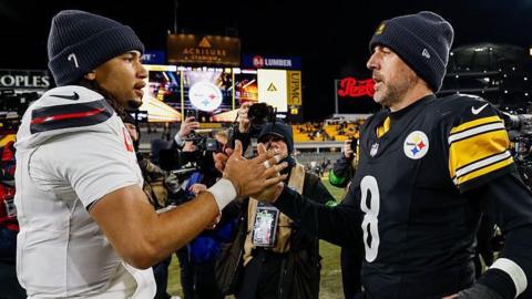Quarterbacks CJ Stroud and Aaron Rodgers shake hands after the Houston Texans beat the Pittsburgh Steelers