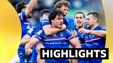 Wakefield's Seth Nikotemo celebrates scoring a try against Huddersfield with Harvey Smith.