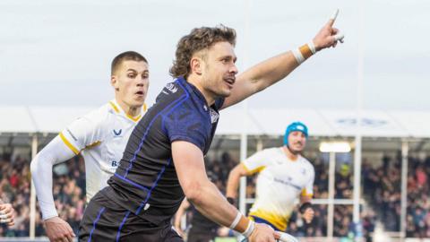 Kyle Rowe celebrates his try