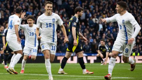 Greece celebrate scoring against Scotland at Hampden